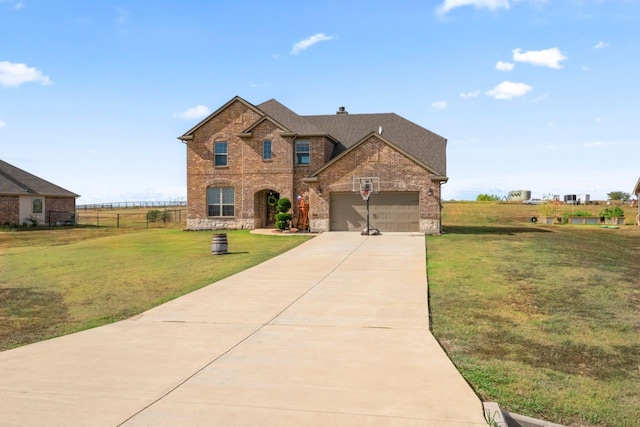 view of front facade featuring a garage and a front lawn