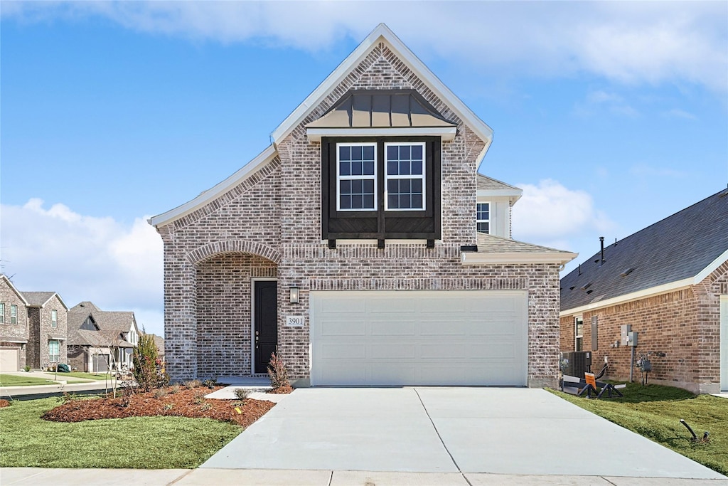 view of front facade featuring a garage, central AC unit, and a front lawn