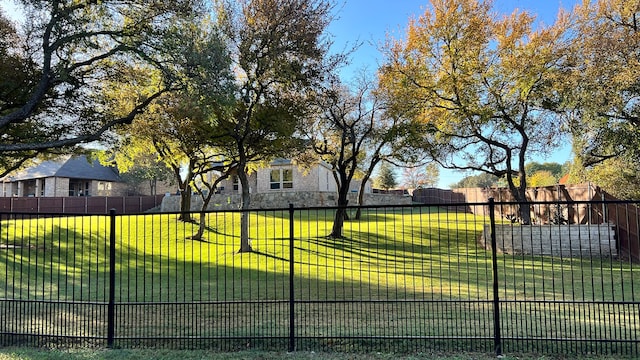 view of gate featuring a lawn