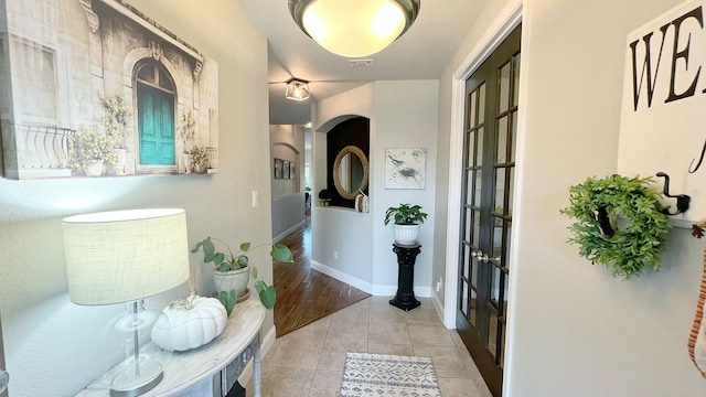 hallway with light tile patterned floors