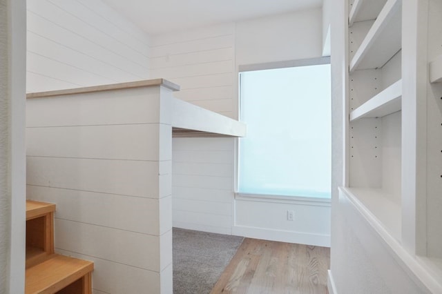 spacious closet featuring light hardwood / wood-style flooring