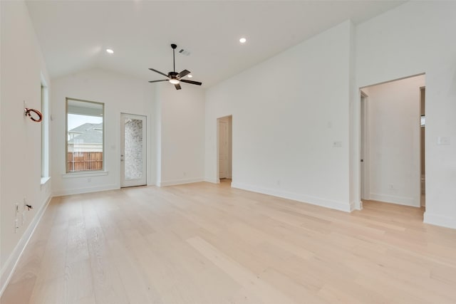 unfurnished room featuring visible vents, light wood-style floors, ceiling fan, high vaulted ceiling, and baseboards