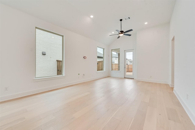 empty room with recessed lighting, visible vents, light wood-style floors, vaulted ceiling, and baseboards