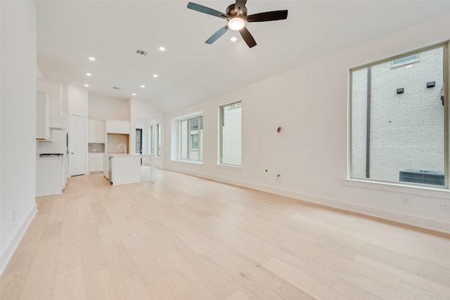 unfurnished living room featuring light wood-style floors, recessed lighting, baseboards, and a ceiling fan