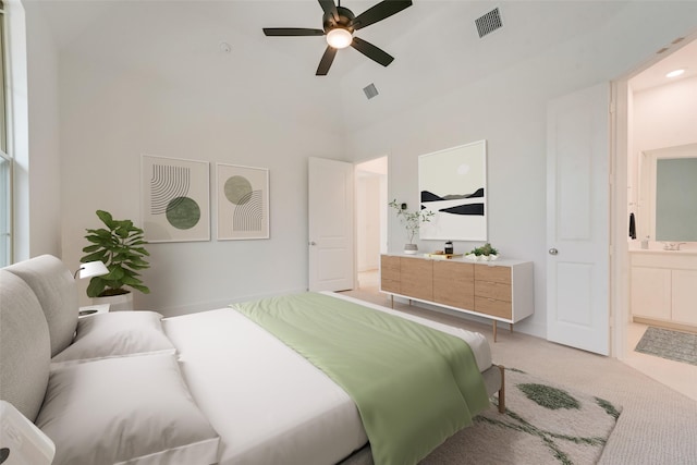 bedroom with light carpet, ceiling fan, connected bathroom, and visible vents