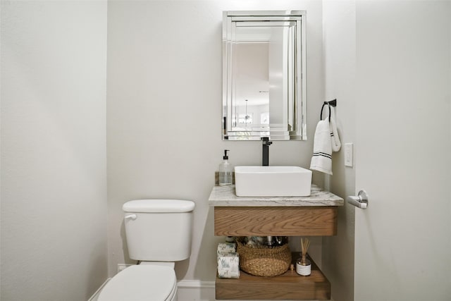 bathroom featuring sink and toilet