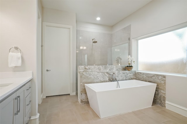 bathroom featuring tile walls, a wealth of natural light, and plus walk in shower