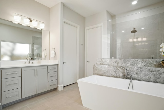 bathroom featuring independent shower and bath and vanity