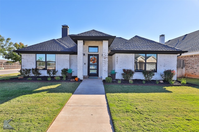 view of front of home with a front yard