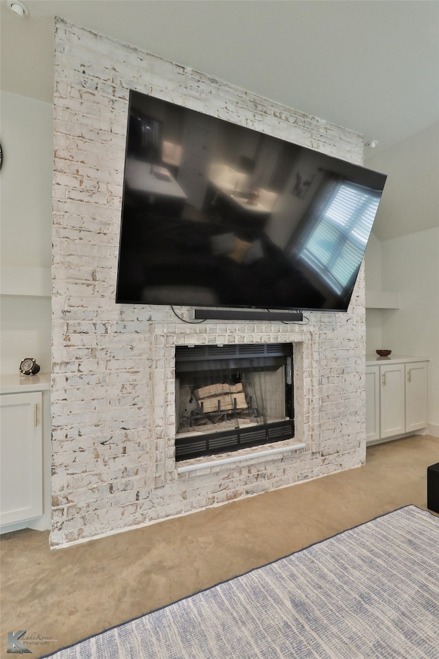 room details featuring a brick fireplace