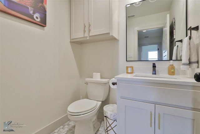 bathroom with vanity and toilet