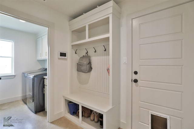 mudroom with separate washer and dryer