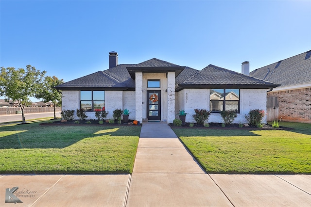 view of front of home with a front yard