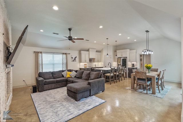 living room with sink, vaulted ceiling, and ceiling fan