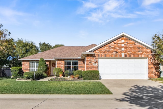 ranch-style home with a garage and a front yard