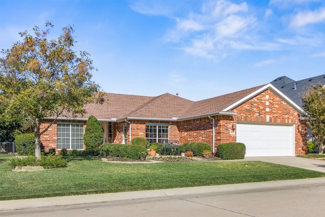 ranch-style home featuring a garage and a front yard