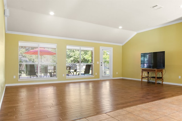 unfurnished living room with crown molding, light wood-type flooring, and vaulted ceiling