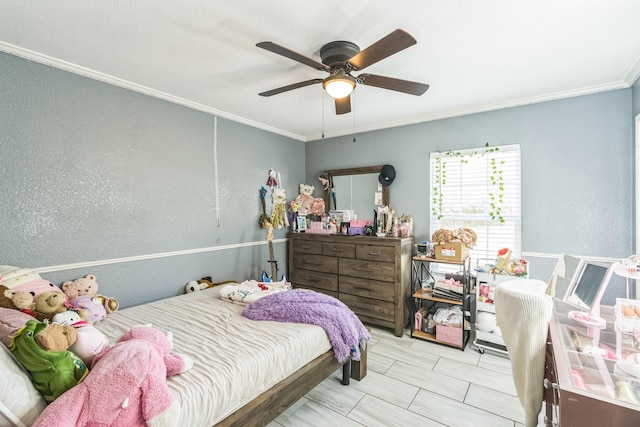 bedroom with ceiling fan and crown molding