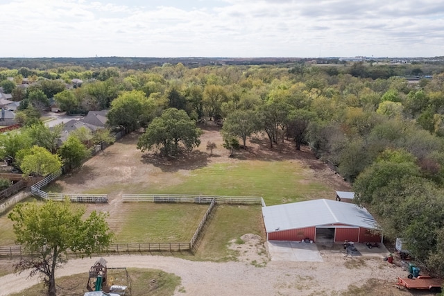 birds eye view of property with a rural view