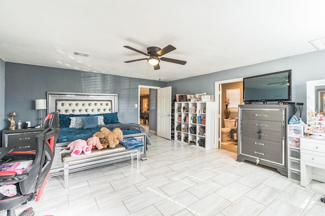 bedroom featuring ceiling fan and connected bathroom