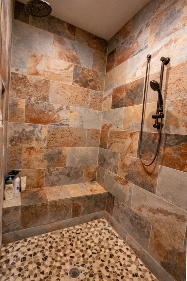 bathroom with tiled shower