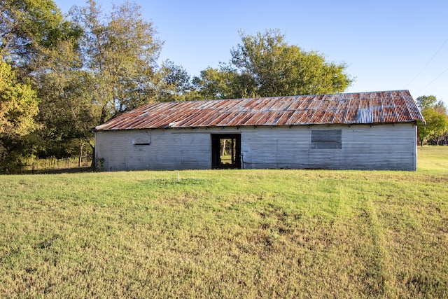 view of outdoor structure with a lawn