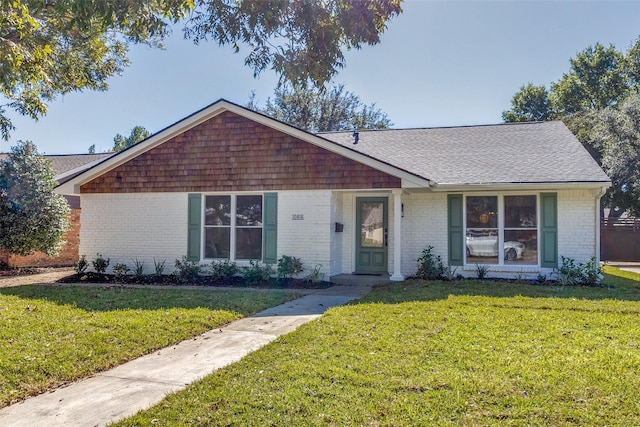 ranch-style home with a front lawn