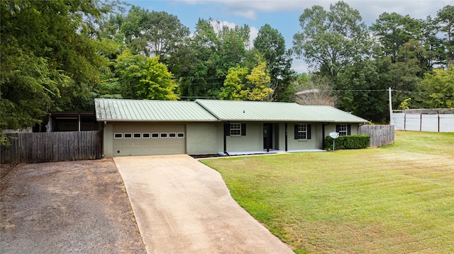 ranch-style house with a garage and a front yard