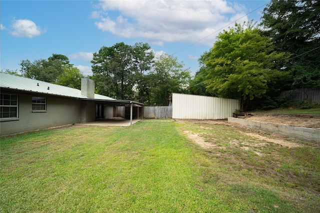 view of yard with a carport