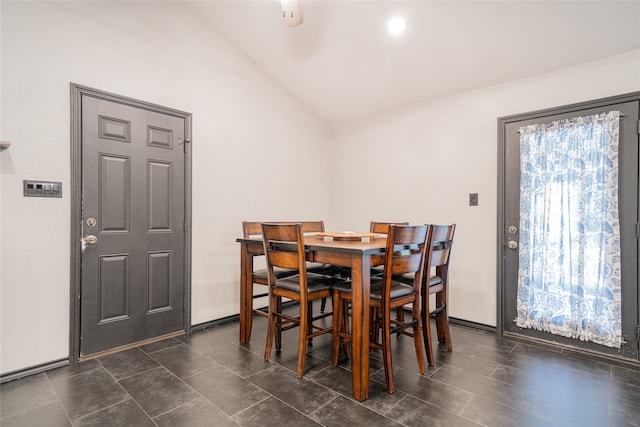 dining area with vaulted ceiling