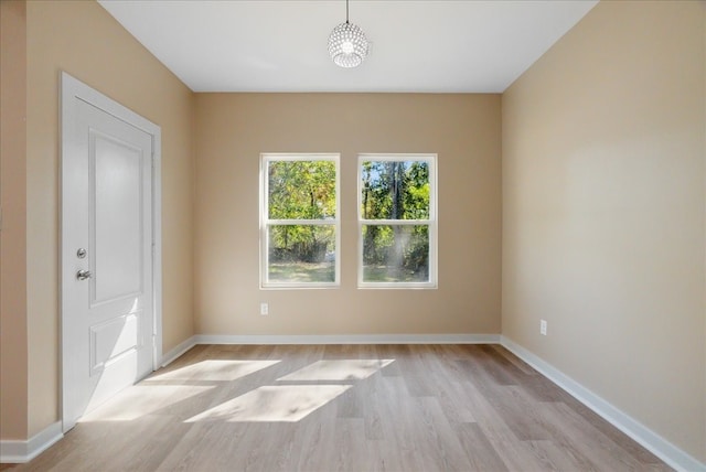 unfurnished room featuring light hardwood / wood-style flooring