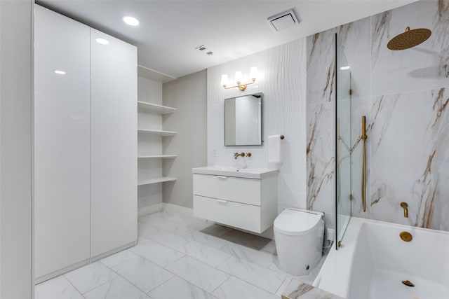 full bathroom featuring vanity, toilet, and tiled shower / bath