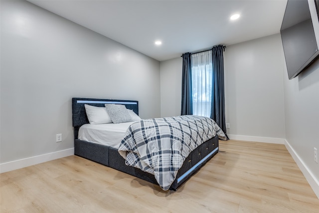 bedroom with light wood-type flooring