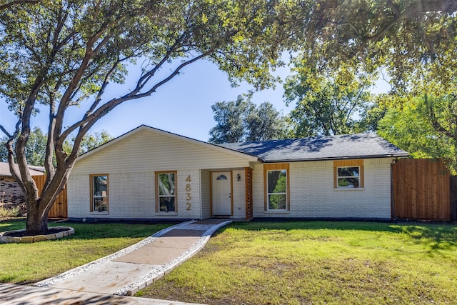 ranch-style house with a front yard