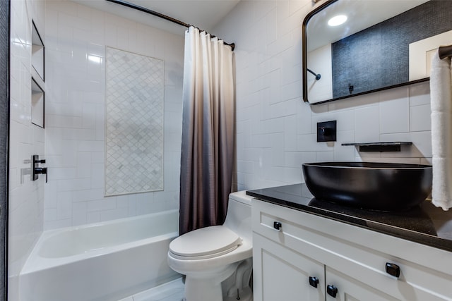 full bathroom featuring tile walls, vanity, shower / tub combo, decorative backsplash, and toilet