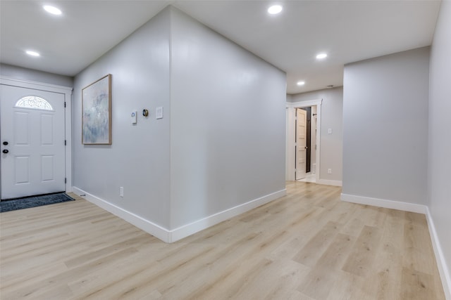 foyer entrance with light wood-type flooring