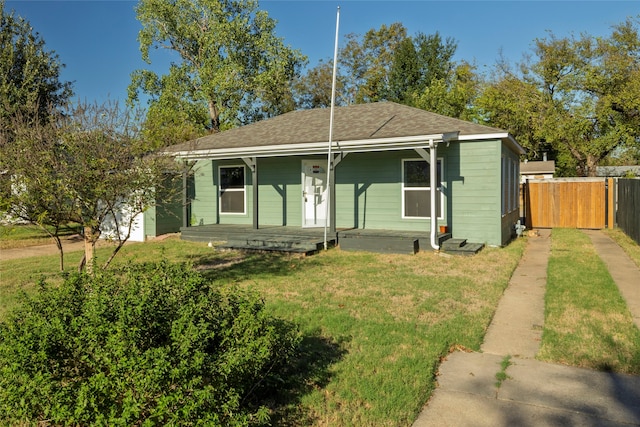 view of front facade with a front lawn and a porch