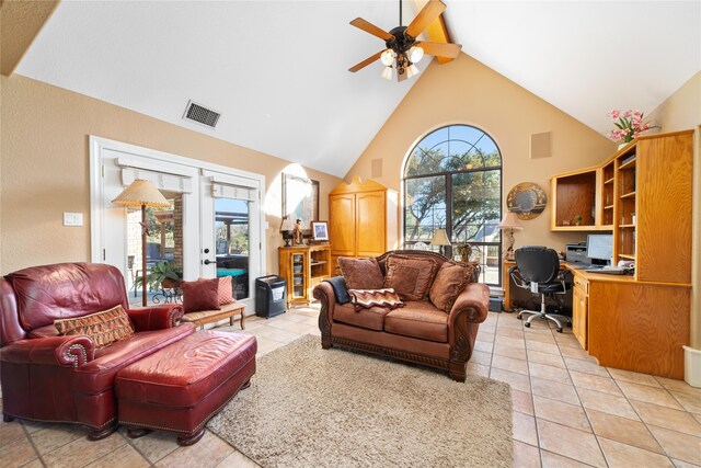 living room with high vaulted ceiling, ceiling fan, built in desk, and a healthy amount of sunlight