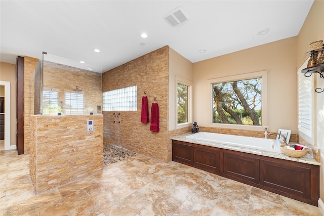 bathroom with separate shower and tub