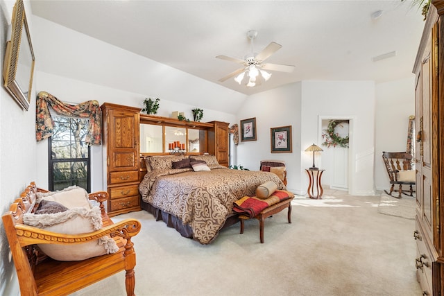 carpeted bedroom with vaulted ceiling and ceiling fan