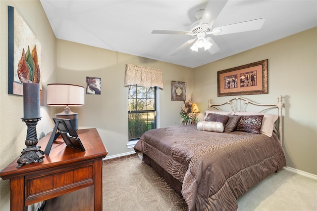 bedroom featuring ceiling fan and carpet