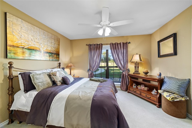 carpeted bedroom featuring access to outside and ceiling fan