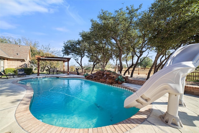 view of pool featuring a water slide and a patio area