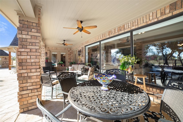 view of patio / terrace featuring ceiling fan and an outdoor living space