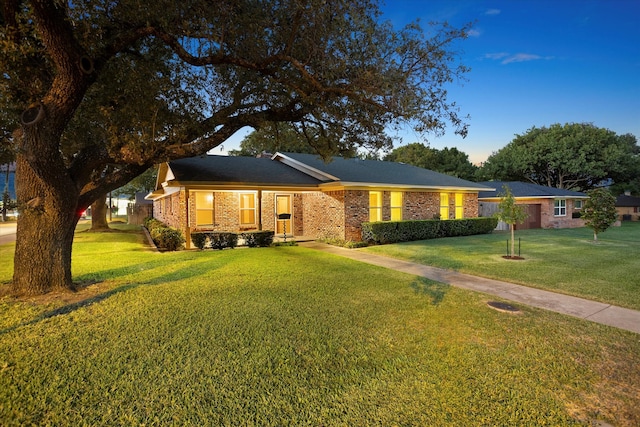 ranch-style home with a front yard