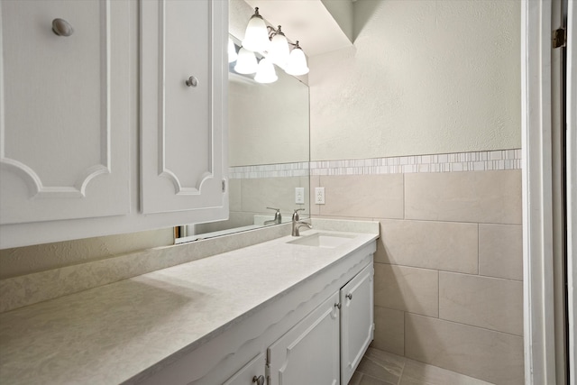 bathroom featuring tile walls and vanity