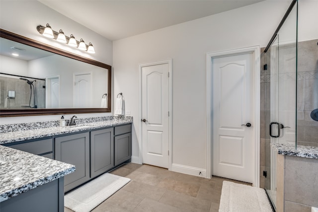 bathroom featuring walk in shower and vanity