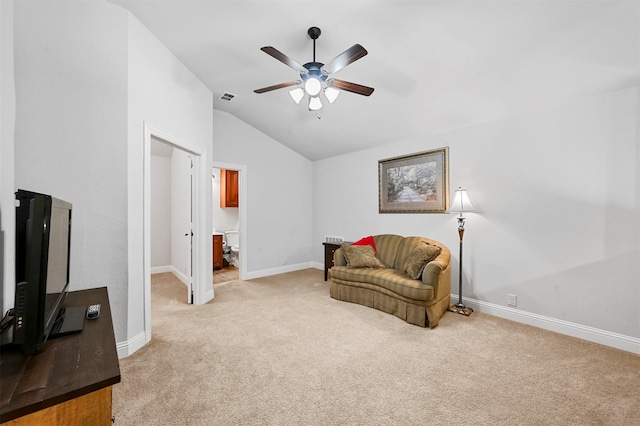 living area featuring lofted ceiling, light carpet, and ceiling fan