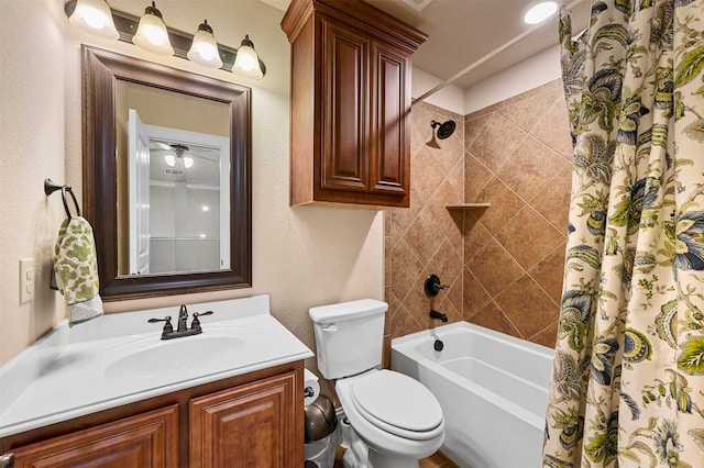 full bathroom featuring shower / bath combo with shower curtain, ceiling fan, vanity, and toilet