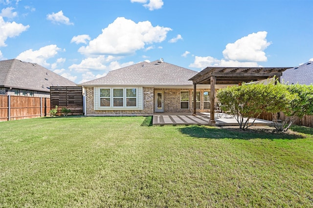 rear view of property with a patio area, a lawn, and a pergola